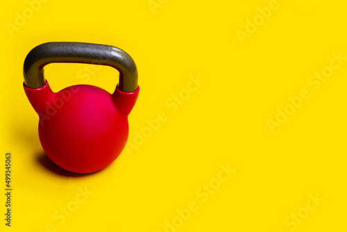 Fototapeta Naklejka Na Ścianę i Meble -  Space background text on with a for yellow Blue Kettlebell isolated fitness, for fit lifting for bodybuilding from healthy gym, weight wellness. Vivid kg shape, man retro athletic strong