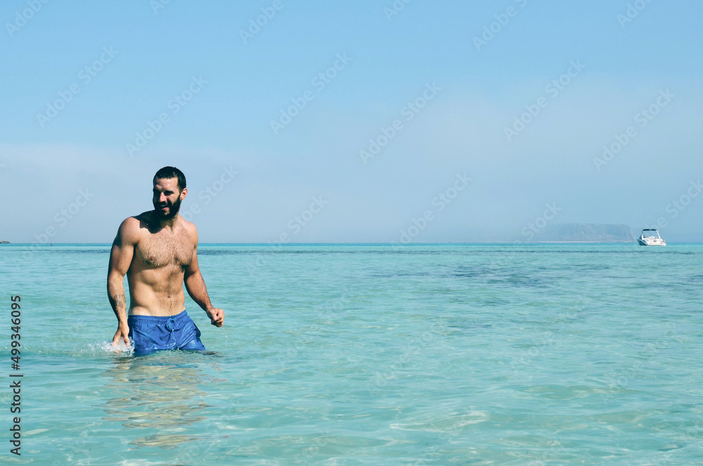 Man swimming in clear water Man swimming in clear water