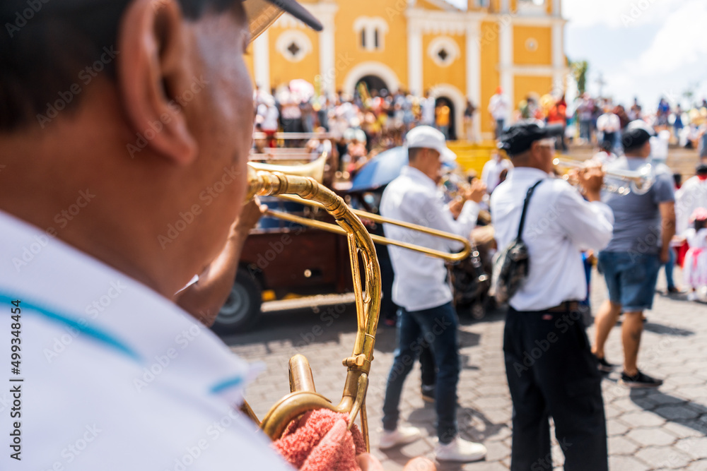 Fototapeta premium Unrecognizable musician in a religious procession during Holy Week in Masatepe, Masaya, Nicaragua.