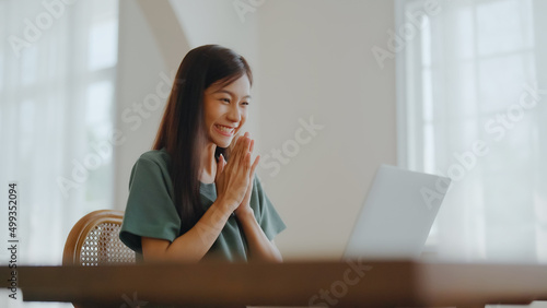 Quadro su tela Excited asian female feeling euphoric celebrating online win success achievement