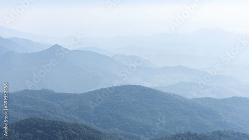 Mountain range layer with faded fog.