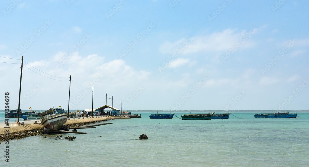 Samll harbor with fishing boats and ferries in Sri Lanka