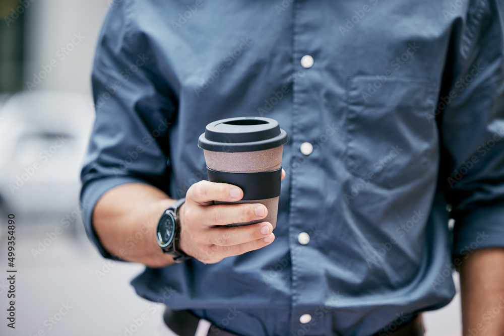 Have a break. Cropped shot of an unrecognizable businessman holding a takeaway coffee while standing in his office. Have a break. Cropped shot of an unrecognizable businessman holding a takeaway coffee while standing in his office.