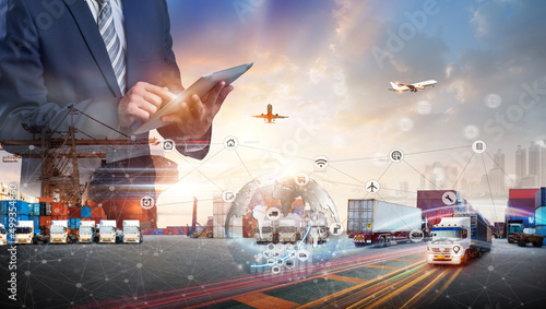 Smart technology logistics concept, Businessman touching virtual screen world map of Global logistics network distribution, Air cargo trucking, Rail transportation, Online goods orders worldwide