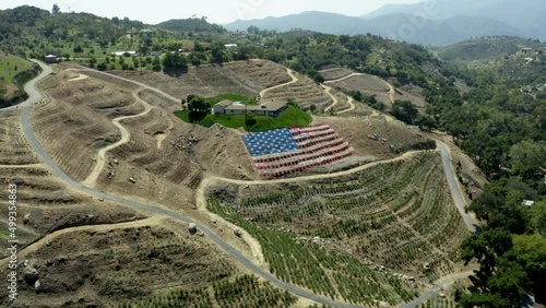 American Flag in Landscape On Hill Drone Footage Hillside