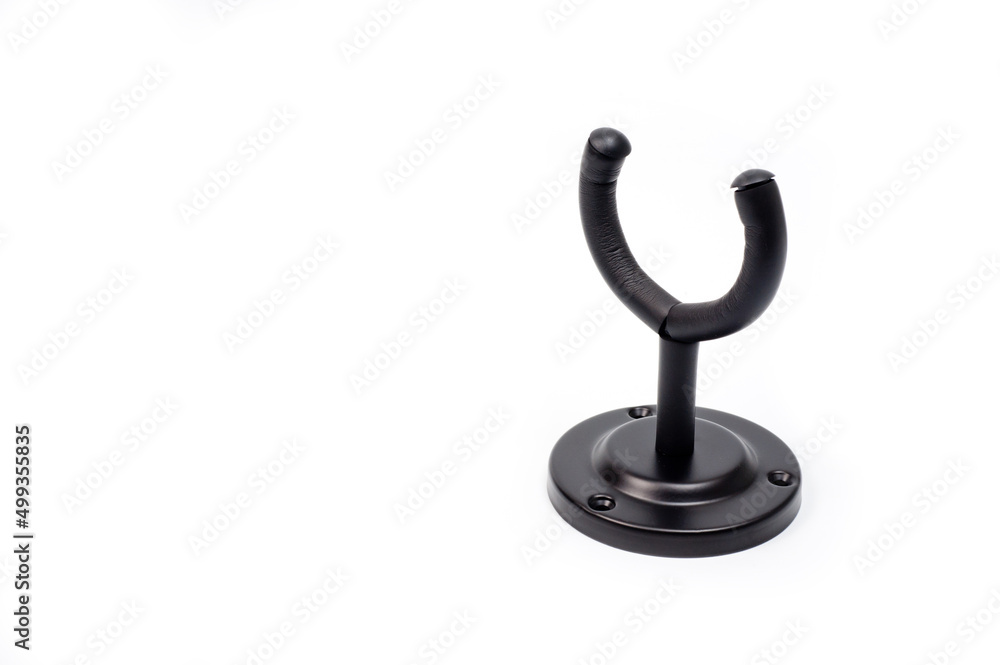 Wall mounted metal holder for acoustic or electric guitar. Wall mounted metal holder for acoustic or electric guitar.