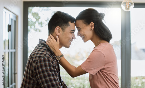 Love is when you accept someones flaws. Shot of a couple spending time together in the kitchen at home.