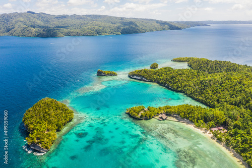 A most beautiful island. High angle shot of the Raja Ampat Islands surrounded by the Indo-Pacific Ocean.