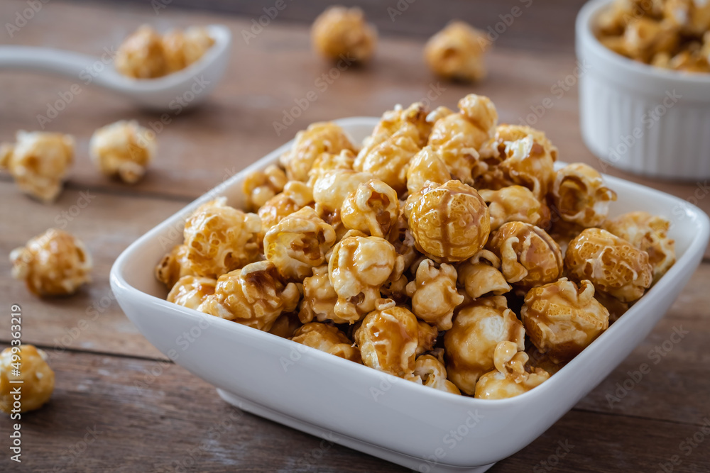 Popcorn with caramel in white bowl Popcorn with caramel in white bowl