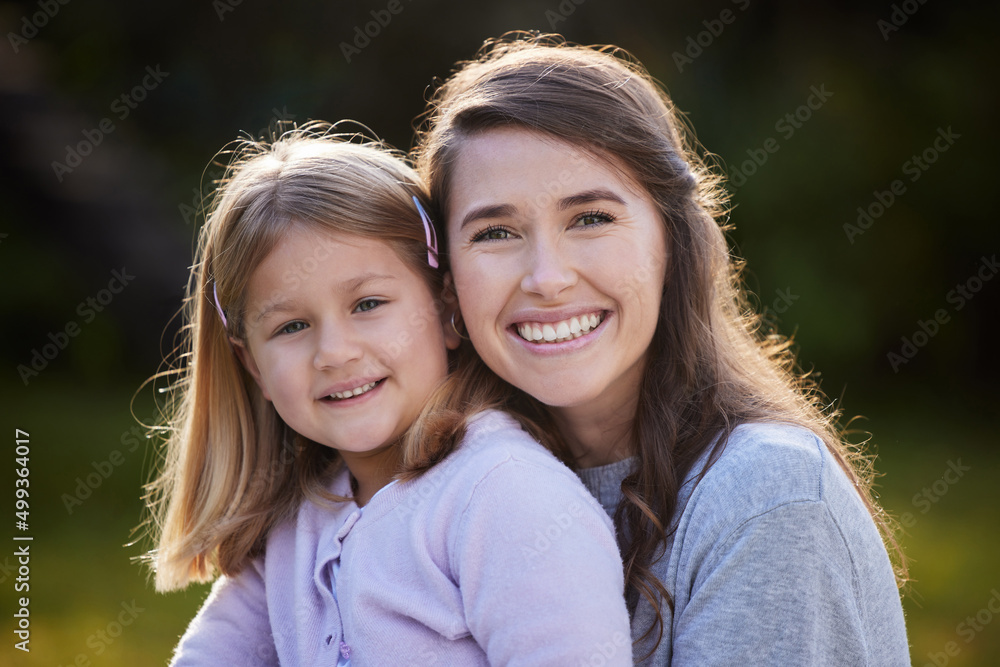 I cant imagine my life without her. Cropped portrait of an attractive young woman and her daughter posing outside in the garden at home. I cant imagine my life without her. Cropped portrait of an attractive young woman and her daughter posing outside in the garden at home.