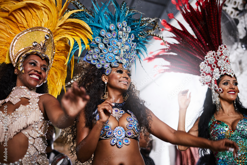 Stealing the show with their dazzling performances. Shot of samba dancers performing in a carnival. Stealing the show with their dazzling performances. Shot of samba dancers performing in a carnival.