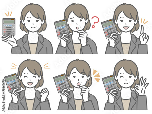 電卓を手に持つスーツの中年女性