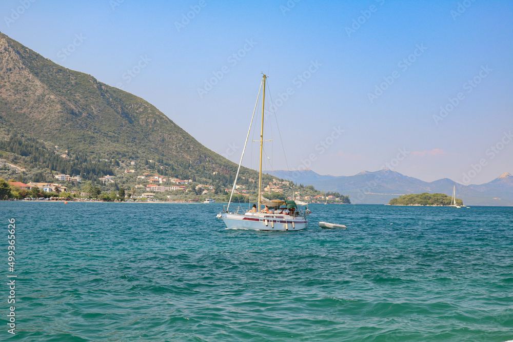 Fototapeta premium view of the sea, boats and mountains, Nidri, Lefkada