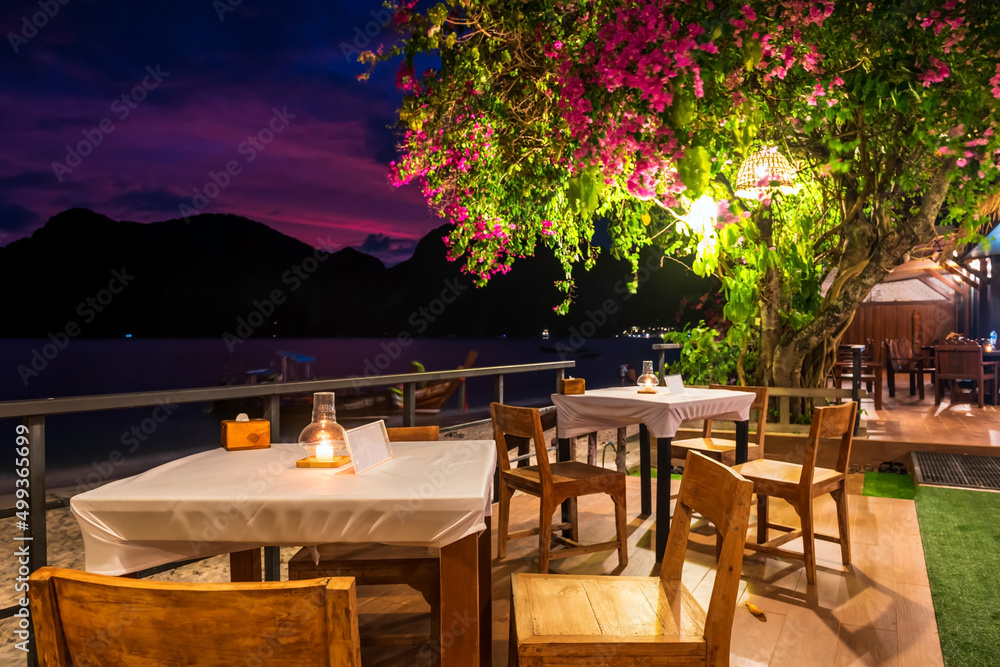 Fototapeta premium Dinner table by coastline at Phi Phi Don island, Krabi