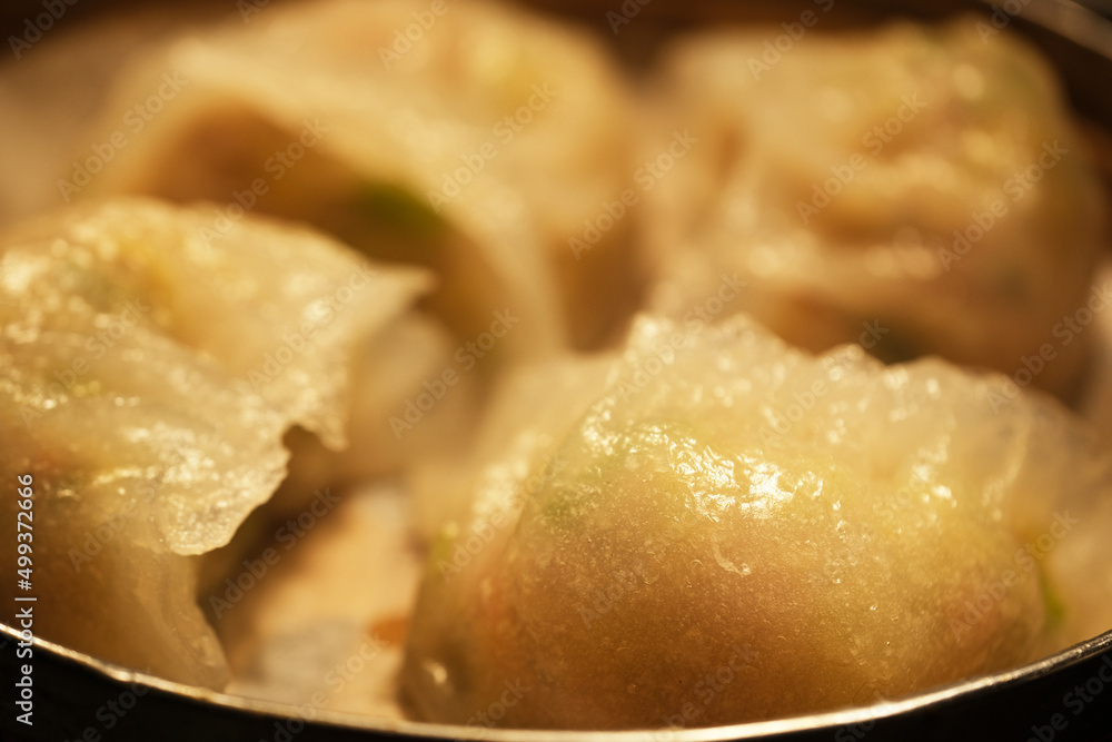 close up steamed crystal dumplings in steamer. Traditional Chinese dim sum snack close up steamed crystal dumplings in steamer. Traditional Chinese dim sum snack