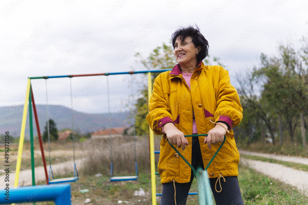 Happy smiling senior women have fun playing at a playground. Happy smiling senior women have fun playing at a playground.