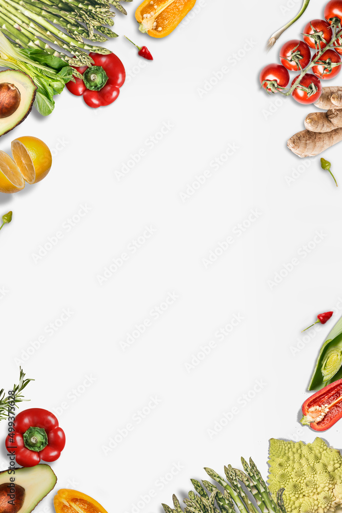 Various vegetables frame with bell pepper, asparagus, tomatoes, ginger, lemon, avocado and chili. Healthy food background on white background. Top view with copy space. Various vegetables frame with bell pepper, asparagus, tomatoes, ginger, lemon, avocado and chili. Healthy food background on white background. Top view with copy space.