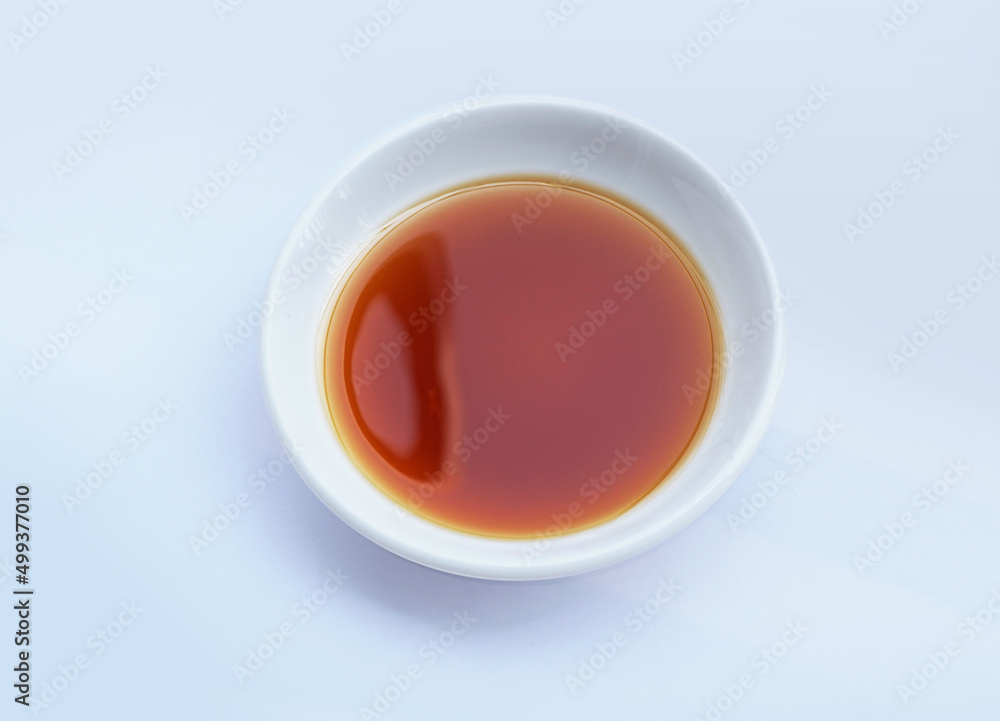 Fish sauce in white bowl isolated on background. Phu Quoc Traditional Fish Sauce. Fish sauce in white bowl isolated on background. Phu Quoc Traditional Fish Sauce.