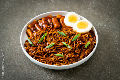 Jjajang Rabokki - Korean instant noodles or Ramyeon with Korean rice cake or Tteokbokki and egg in black bean sauce