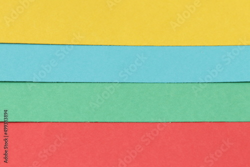 Colored paper. Decorative background from multi-colored paper.