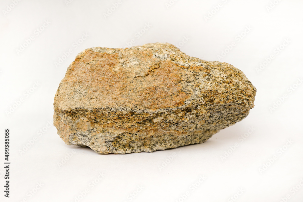 Macro shooting of raw specimen biotite granite gneiss rock isolated on white background. Macro shooting of raw specimen biotite granite gneiss rock isolated on white background.