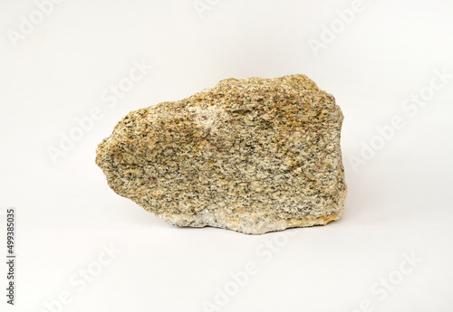 Macro shooting specimen biotite granite gneiss rock isolated on white background.  photo