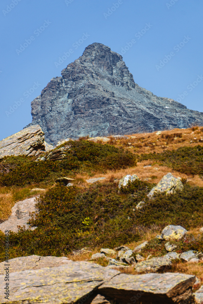 The mountains and peaks with glaciers of Alta Valmalenco, A splendid area of the Italian Alps, in Valtellina, near the town of Chiesa in Valmalenco, Italy - September 2021.