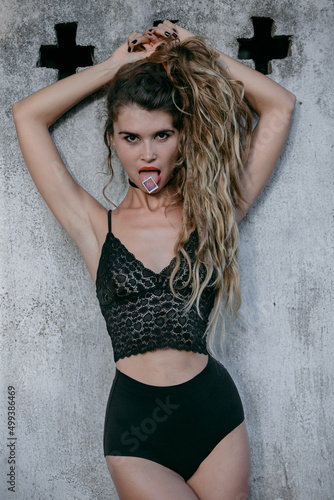 Φωτογραφία Young addicted woman taking LSD postage stamp