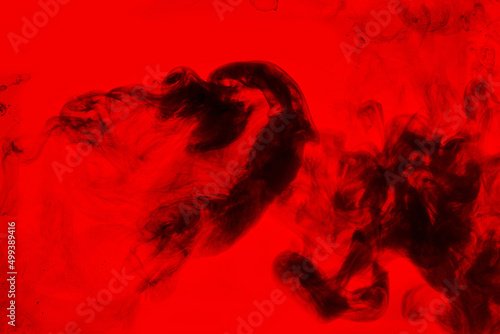 Black and red ink background  colorful fog  abstract swirling ocean  acrylic paint pigment underwater  dark smoke