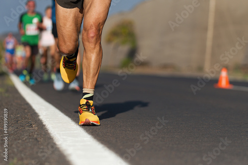 Marathon running race, people running on city road
