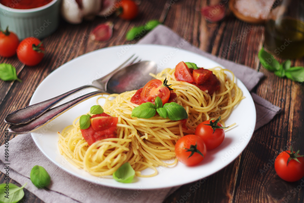 Italian pasta spaghetti with basil and cherry tomatoes Italian pasta spaghetti with basil and cherry tomatoes