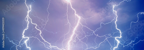 Fork lightning striking down during summer storm 