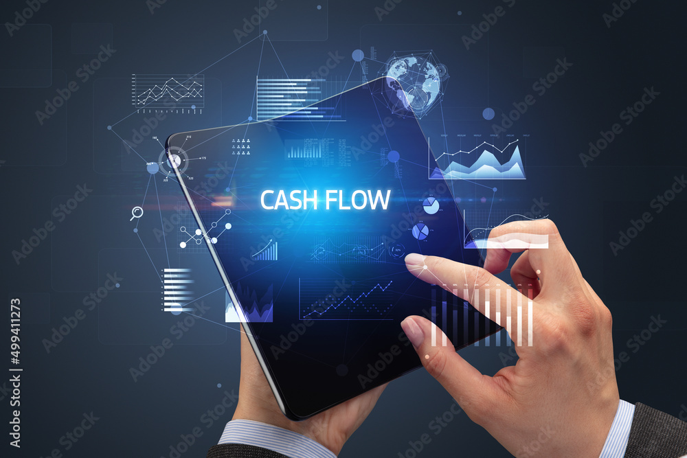 Businessman holding a foldable smartphone, business concept Businessman holding a foldable smartphone, business concept