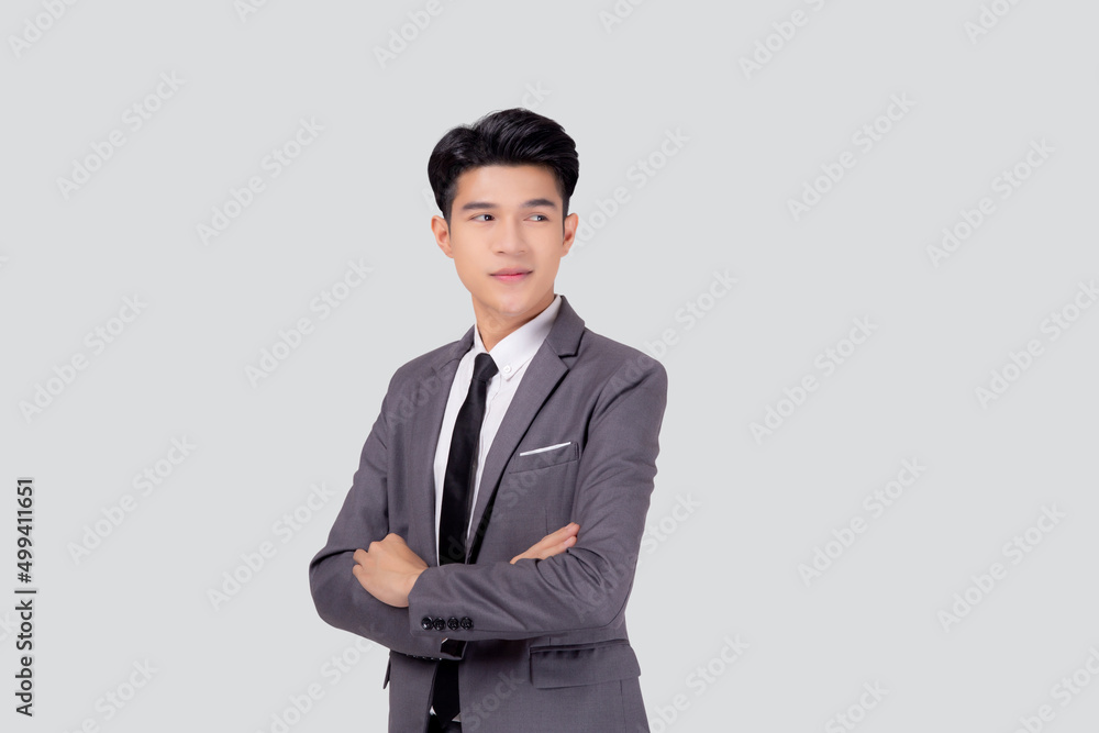 Portrait businessman in suit with crossed his arms standing isolated on white background, young asian business man is manager or executive having confident is positive with success. Portrait businessman in suit with crossed his arms standing isolated on white background, young asian business man is manager or executive having confident is positive with success.