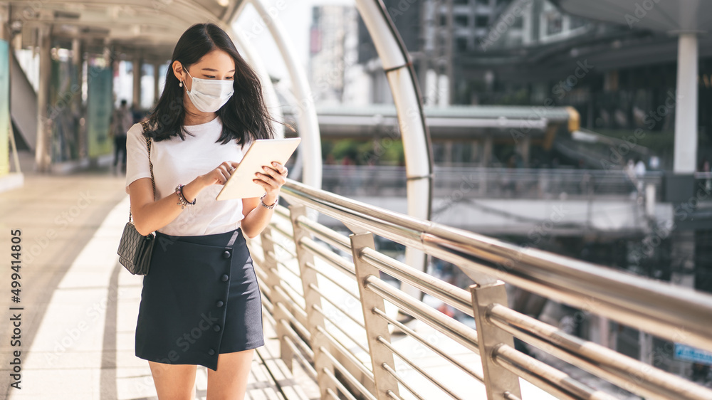 Young adult business entrepreneur working asian woman using digital tablet for online message