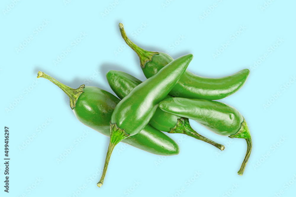 Bunch of hot green jalapeno peppers isolated on blue, top view. Bunch of hot green jalapeno peppers isolated on blue, top view.