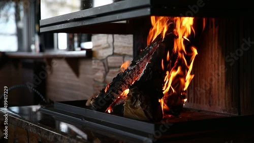 The fire burns in the fireplace. Close-up. selective focus photo