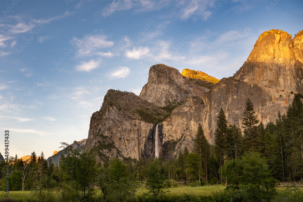 Last light on Bridalveil Falls and Cathedral Spires, at Yosemite Valley View, in Yosemite National Park, near Merced, California.