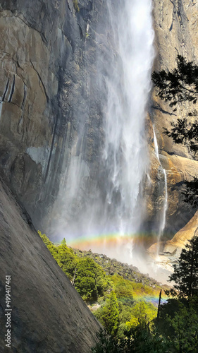 Fototapeta Naklejka Na Ścianę i Meble -  Rainbow created by misty Upper Yosemite Falls, on the Upper Yosemite Falls trail, in Yosemite National Park, near Merced, California.