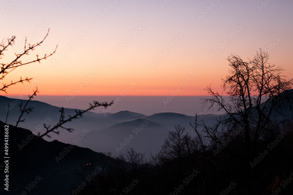 Orange sunrise with mountains