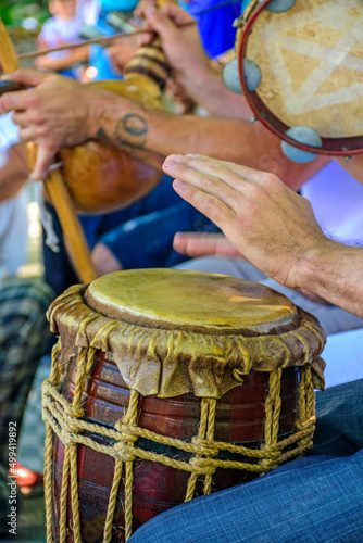 Dum player and other instrumentalists during a Brazilian samba performance at the carnival