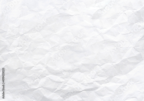 Closeup to white crumpled paper texture background photo