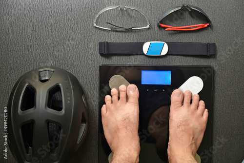 top view of man weighing and equipment for cycling