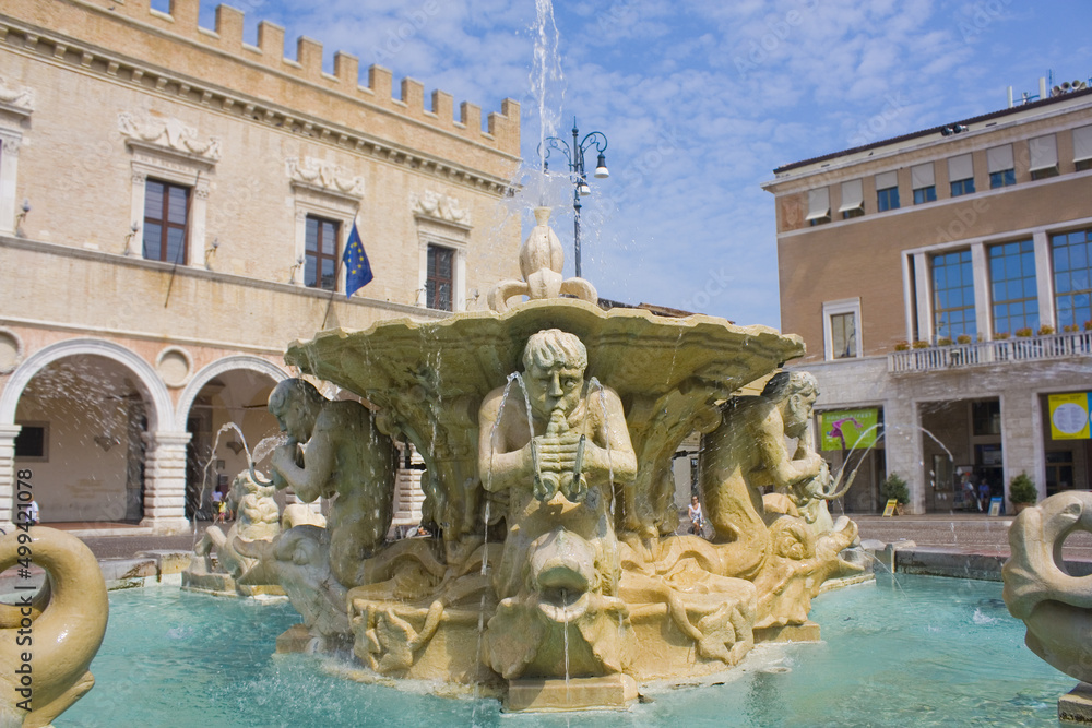 Fountain with figures of newts and dolphins at Piazza Del Popolo in Pesaro, Italy