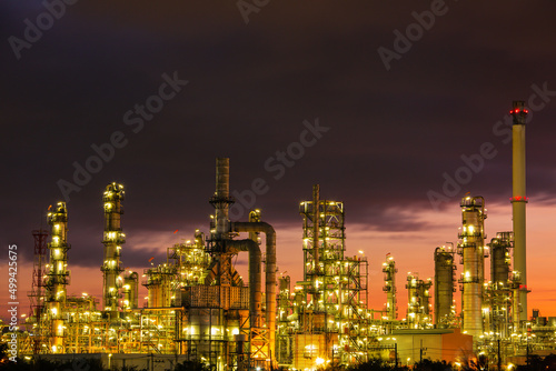 Oil    refinery    and    plant and tower column of petrochemistry industry in pipeline oil    and    gas       industry with    sun red sky the morning