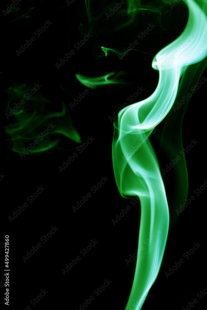 Green smoke on black background Green smoke on black background