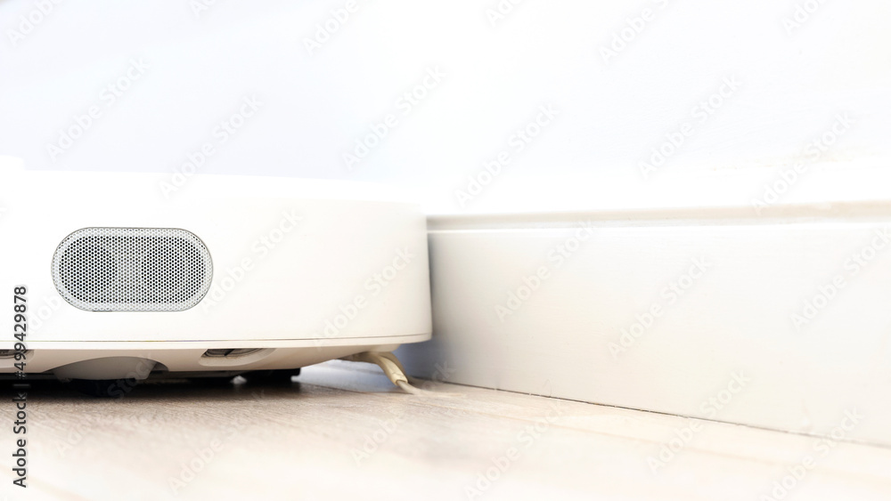 Robot wireless vacuum cleaner working on the floor Robot wireless vacuum cleaner working on the floor