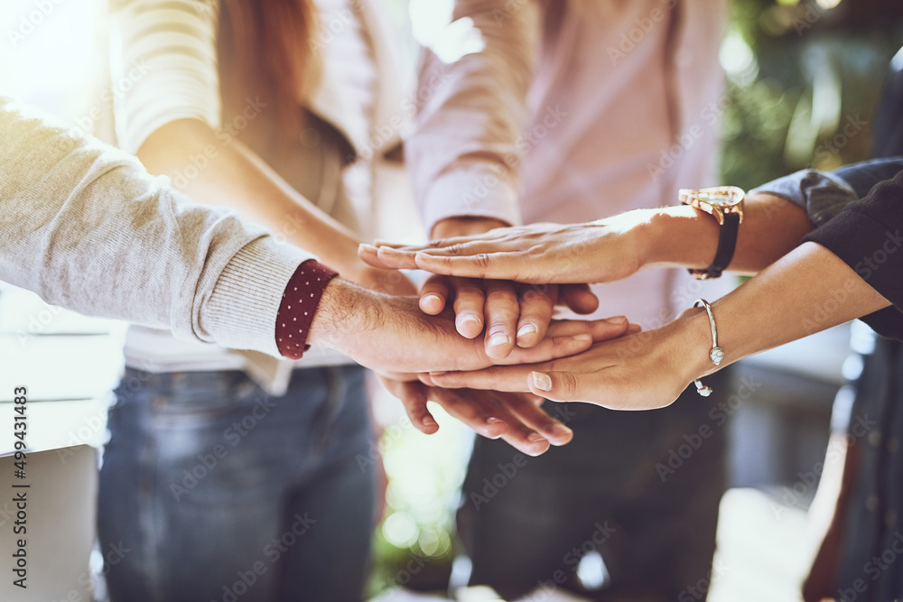 The power of togetherness. Shot of a group of colleagues joining hands in solidarity outdoors. The power of togetherness. Shot of a group of colleagues joining hands in solidarity outdoors.