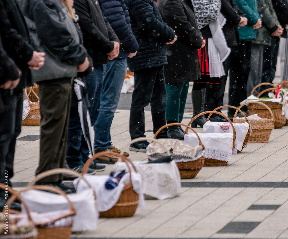 people with food basket waiting for easter blessing people with food basket waiting for easter blessing