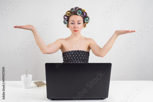 Woman in curlers. Girl spre...
